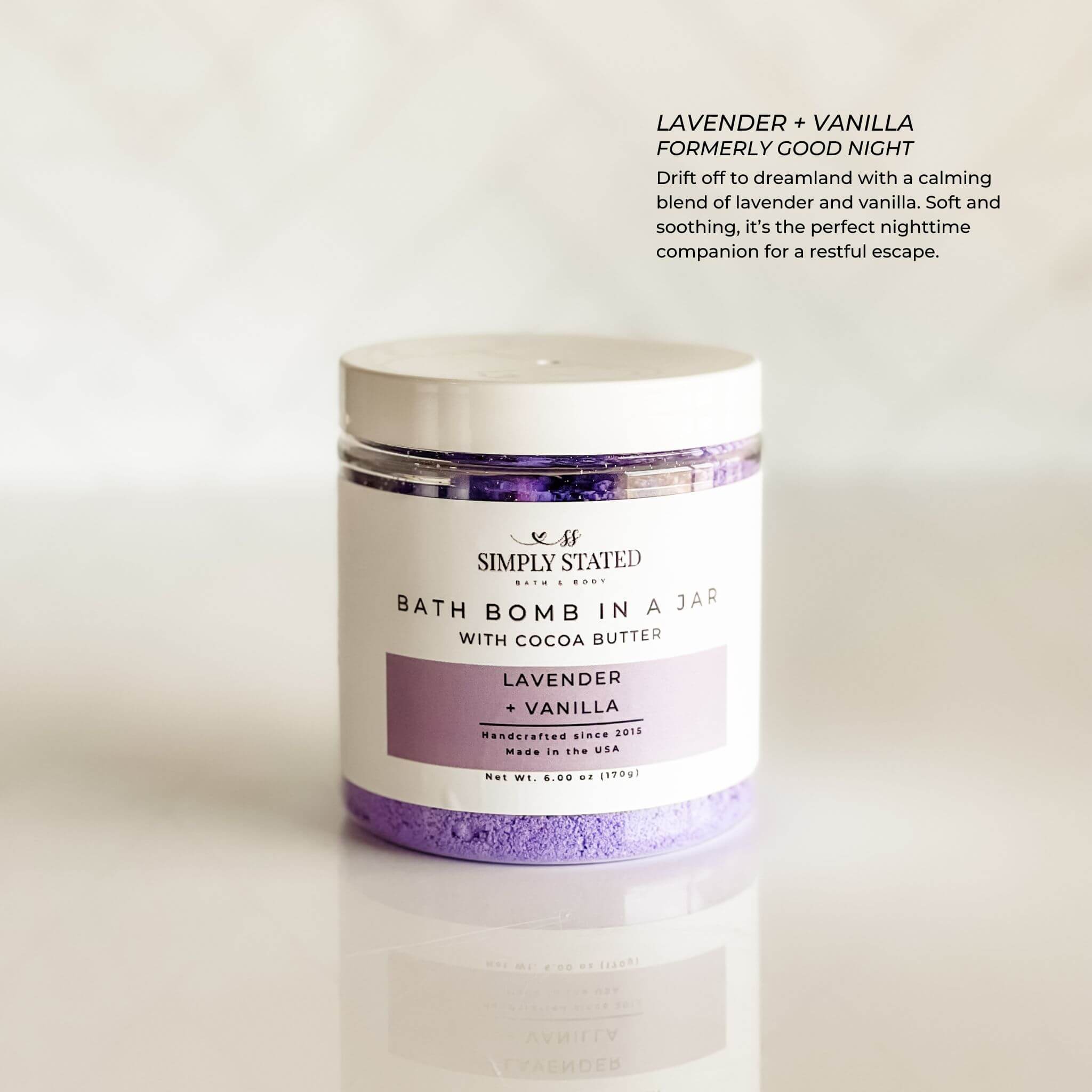 Aromatherapy bath bomb in a jar featuring the Lavender + Vanilla blend. A calming and soothing fragrance perfect for unwinding at the end of the day. Packaged in a sleek, minimalist jar with a soft purple label, designed for a relaxing and moisturizing bath experience.