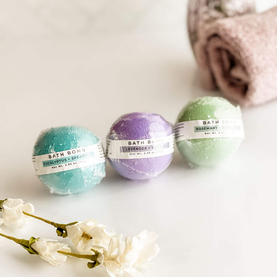 A set of three Simply Stated Bath & Body Aromatherapy Bath Bombs in Eucalyptus + Spearmint, Lavender + Vanilla, and Rosemary + Eucalyptus. Luxurious self-care essentials infused with natural essential oils.
