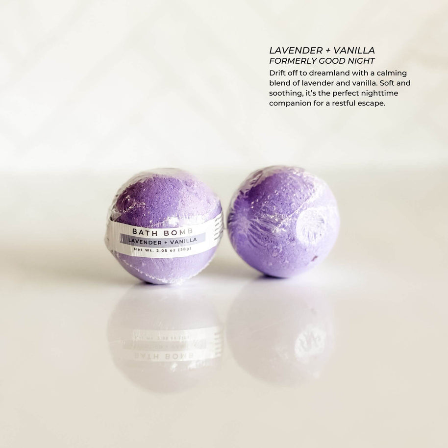 Simply Stated Bath & Body Lavender + Vanilla Bath Bomb, wrapped in clear packaging. A calming blend of lavender and vanilla, perfect for relaxation and bedtime rituals.
