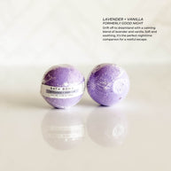 Simply Stated Bath & Body Lavender + Vanilla Bath Bomb, wrapped in clear packaging. A calming blend of lavender and vanilla, perfect for relaxation and bedtime rituals.
