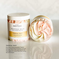 Simply Stated Bath & Body Tropical Twist Whipped Soap for kids. A bright swirl of pink and yellow with a fruity blend of banana, coconut, and zesty citrus for a tropical bath time escape. Made with mango butter for gentle cleansing.