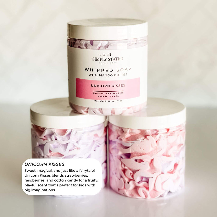 Simply Stated Bath & Body Unicorn Kisses Whipped Soap for kids. A pastel pink and purple swirl with a fruity blend of strawberries, raspberries, and cotton candy. Magical and fun, perfect for kids with big imaginations. Made with mango butter for gentle care.