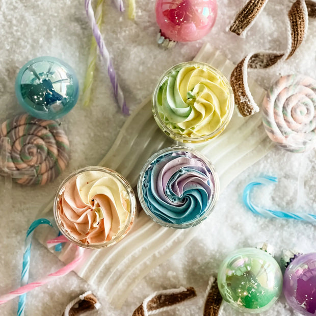 Colorful swirl candies and lollipops on a textured surface