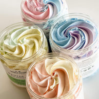 A lineup of colorful whipped soaps with swirled pastel hues, perfect for gentle cleansing and fun bath time.