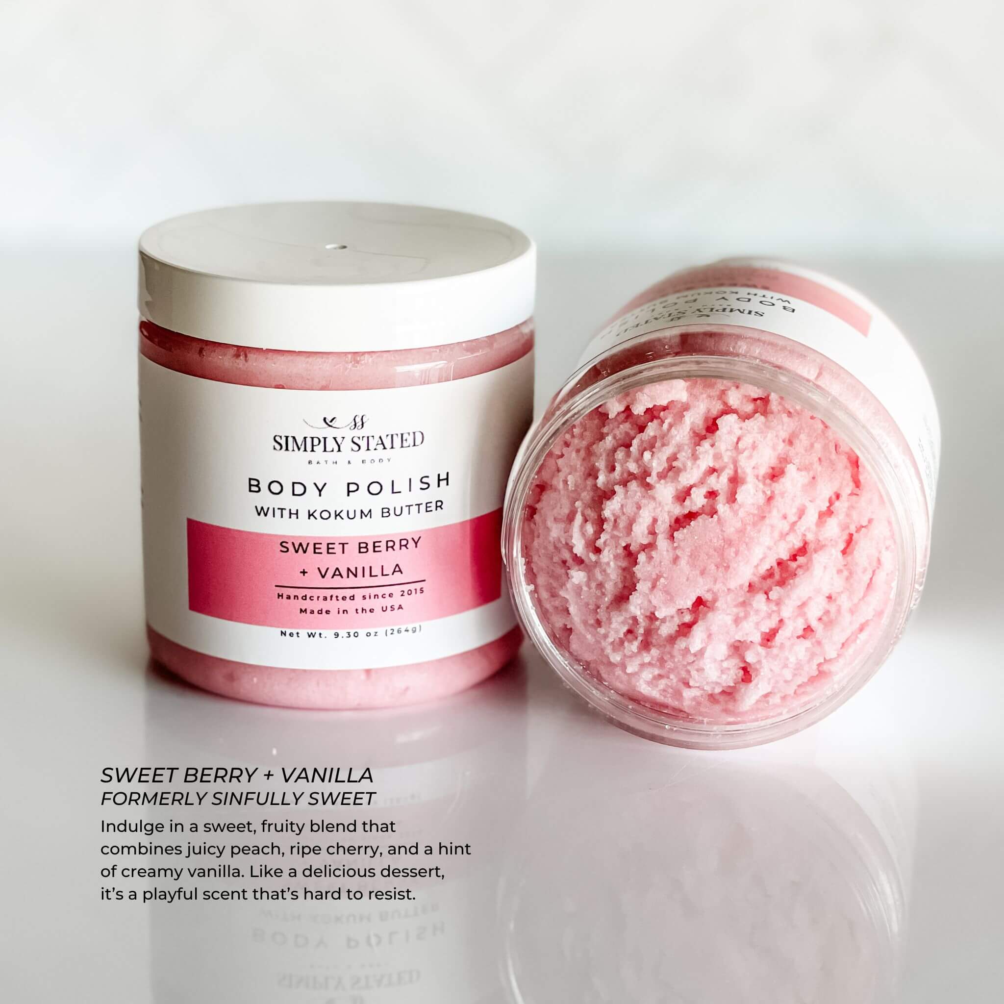 Simply Stated Body Polish in Sweet Berry + Vanilla scent, a playful exfoliating scrub with juicy peach, ripe cherry, and creamy vanilla notes. 9.3 oz jar with updated label design.