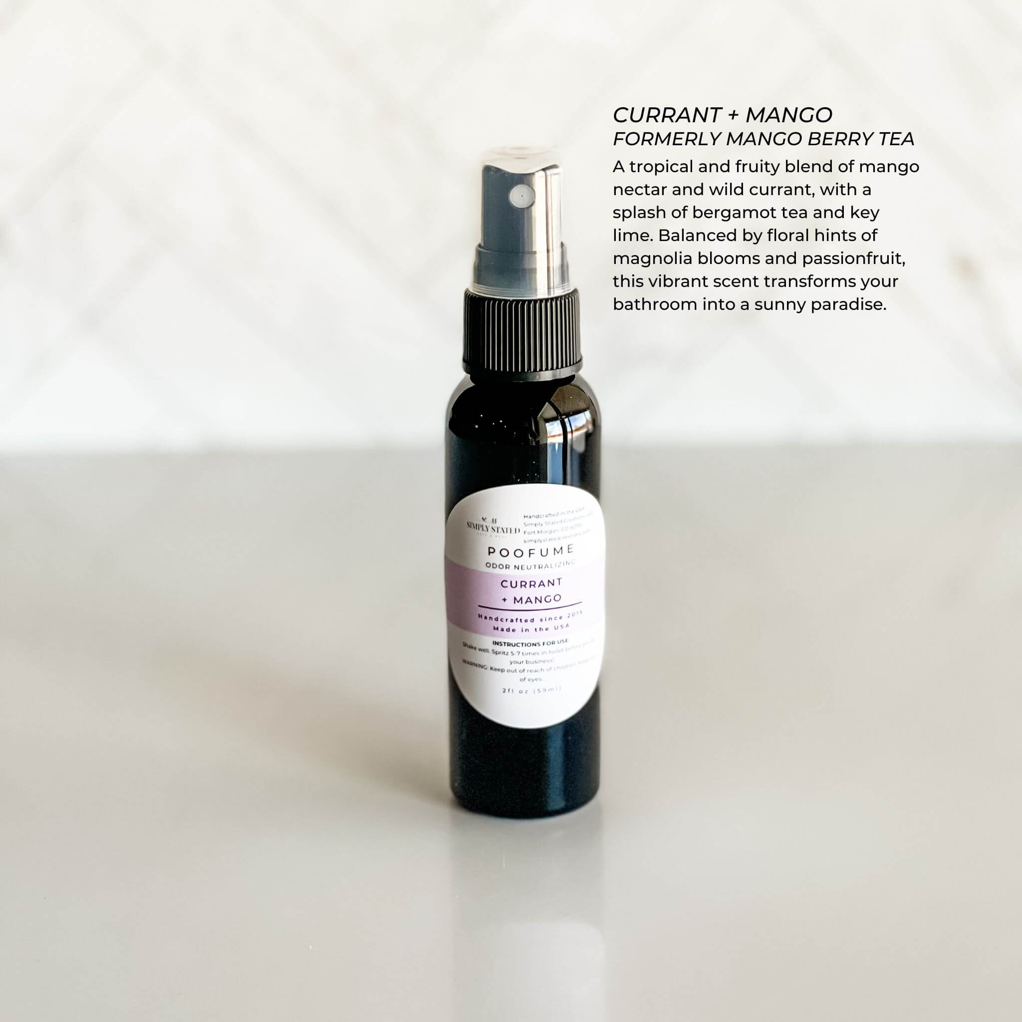 Mini 2oz Simply Stated Poofume with a sweet currant + mango fragrance in a compact bottle.