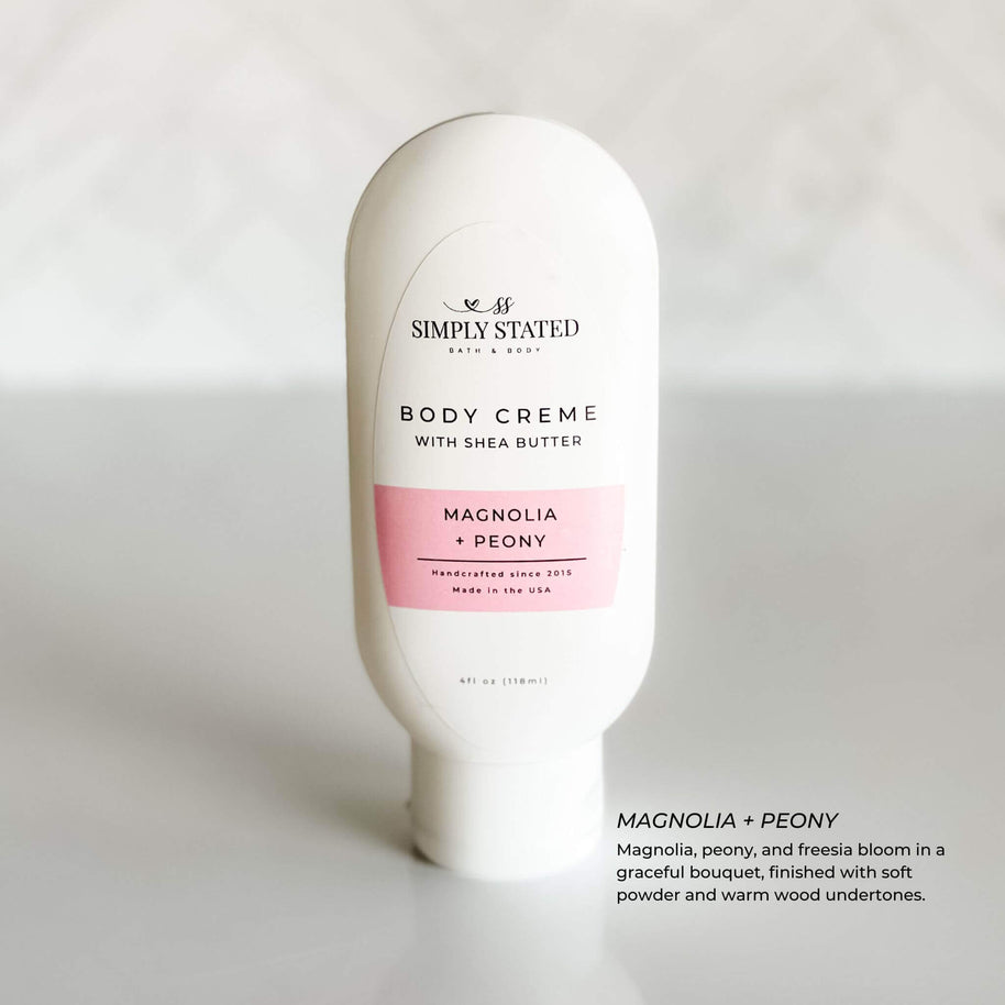 Simply Stated Magnolia + Peony Body Creme with shea butter, featuring soft floral notes of magnolia and peony with a touch of warm wood.