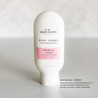 Simply Stated Magnolia + Peony Body Creme with shea butter, featuring soft floral notes of magnolia and peony with a touch of warm wood.